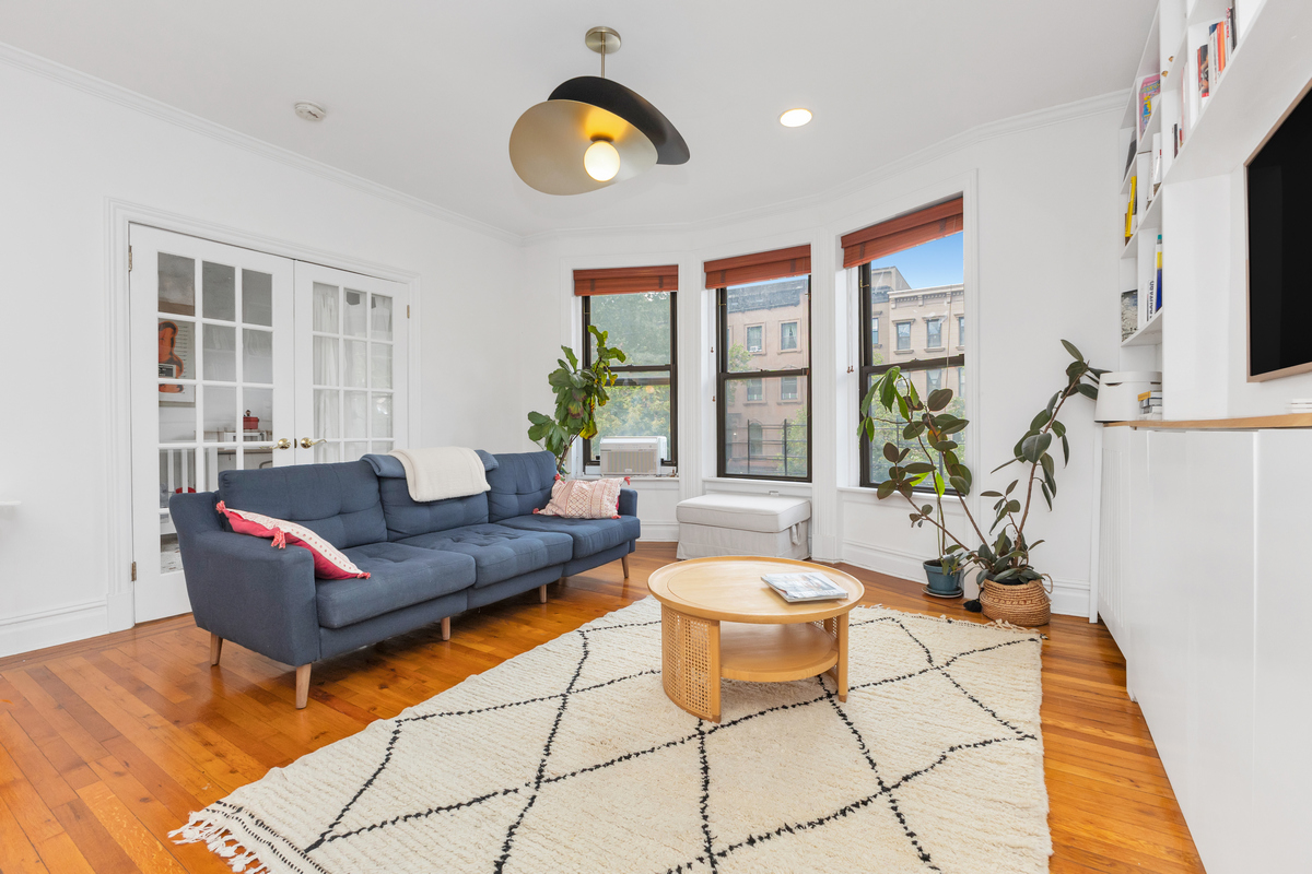 74 2nd Place, Unit 2B Brooklyn, NY 11231 - Photo 4 of 14 a living room with patio furniture and a wooden floor