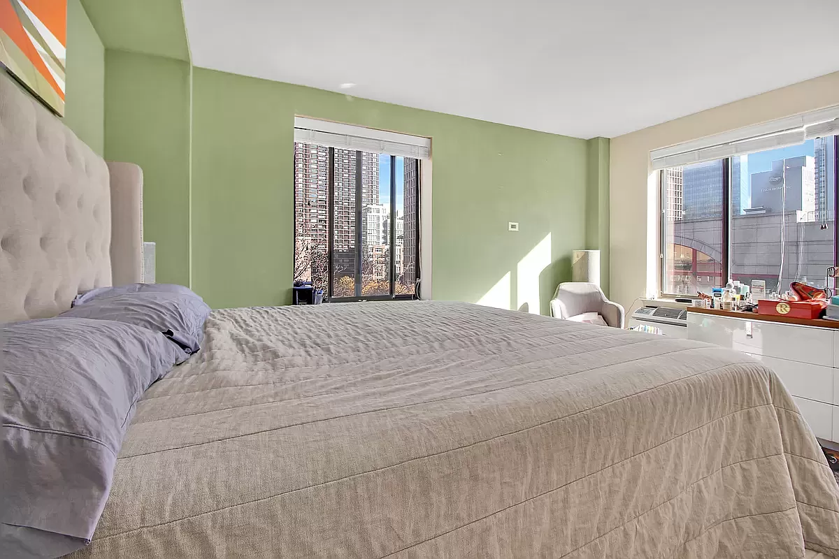 250 East 31st Street, Unit 5A Manhattan, NY 10016 - Photo 4 of 7 a bedroom with a large bed and a large window