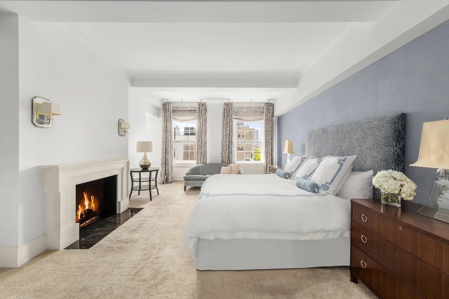 a bedroom with a bed and a fireplace