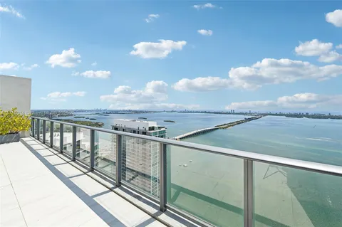 a view of a lake from a balcony
