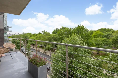 a view of a balcony with chairs