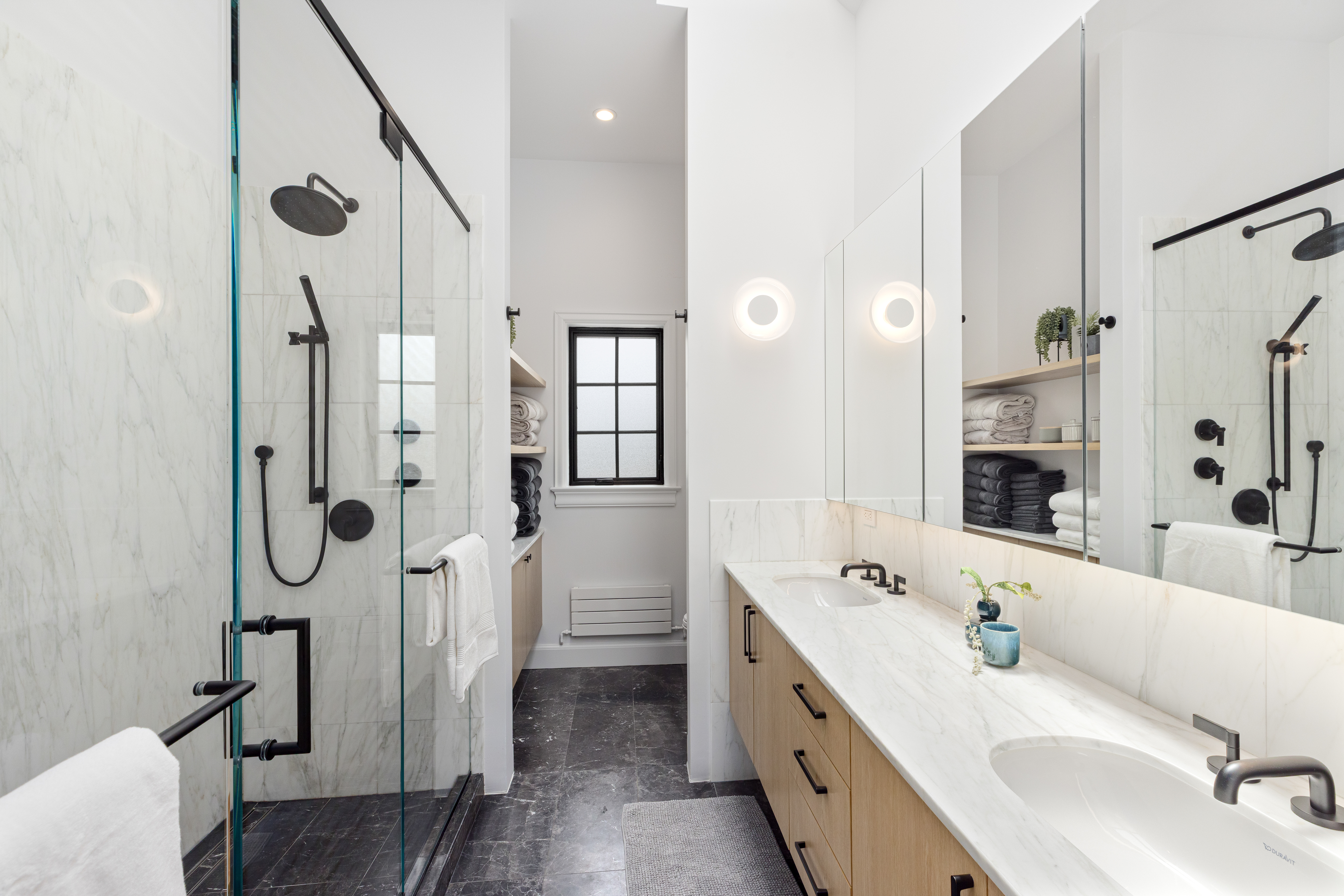 179 Devoe Street Brooklyn, NY 11211 - Photo 8 of 20 a spacious bathroom with a double vanity sink mirror and shower