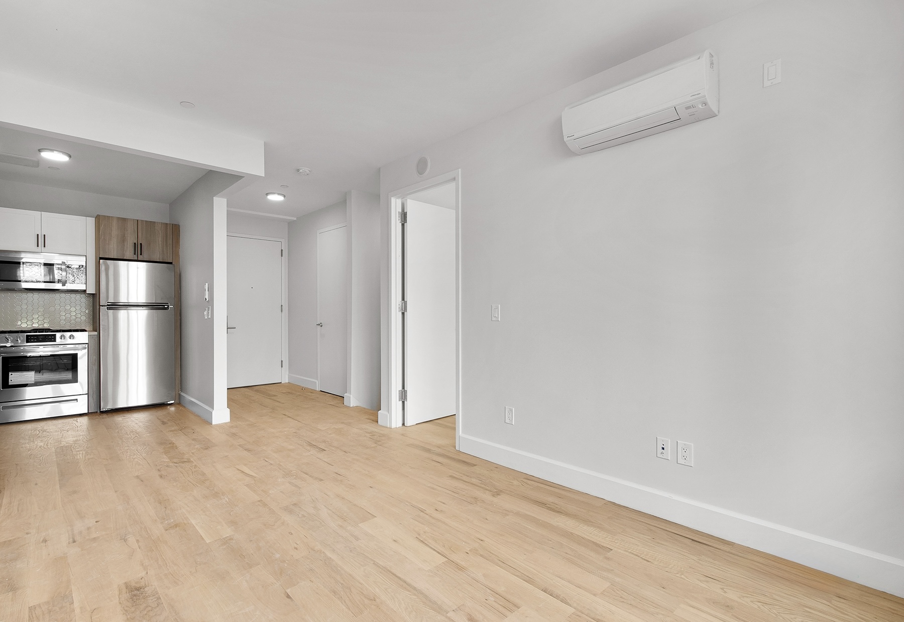 1098 Madison Street, Unit 1B Brooklyn, NY 11221 - Photo 5 of 16 a view of empty room with wooden floor