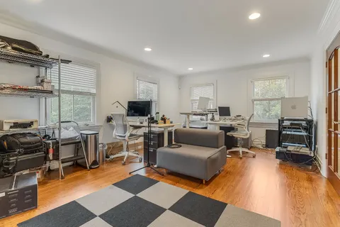 a living room with furniture fireplace and a flat screen tv