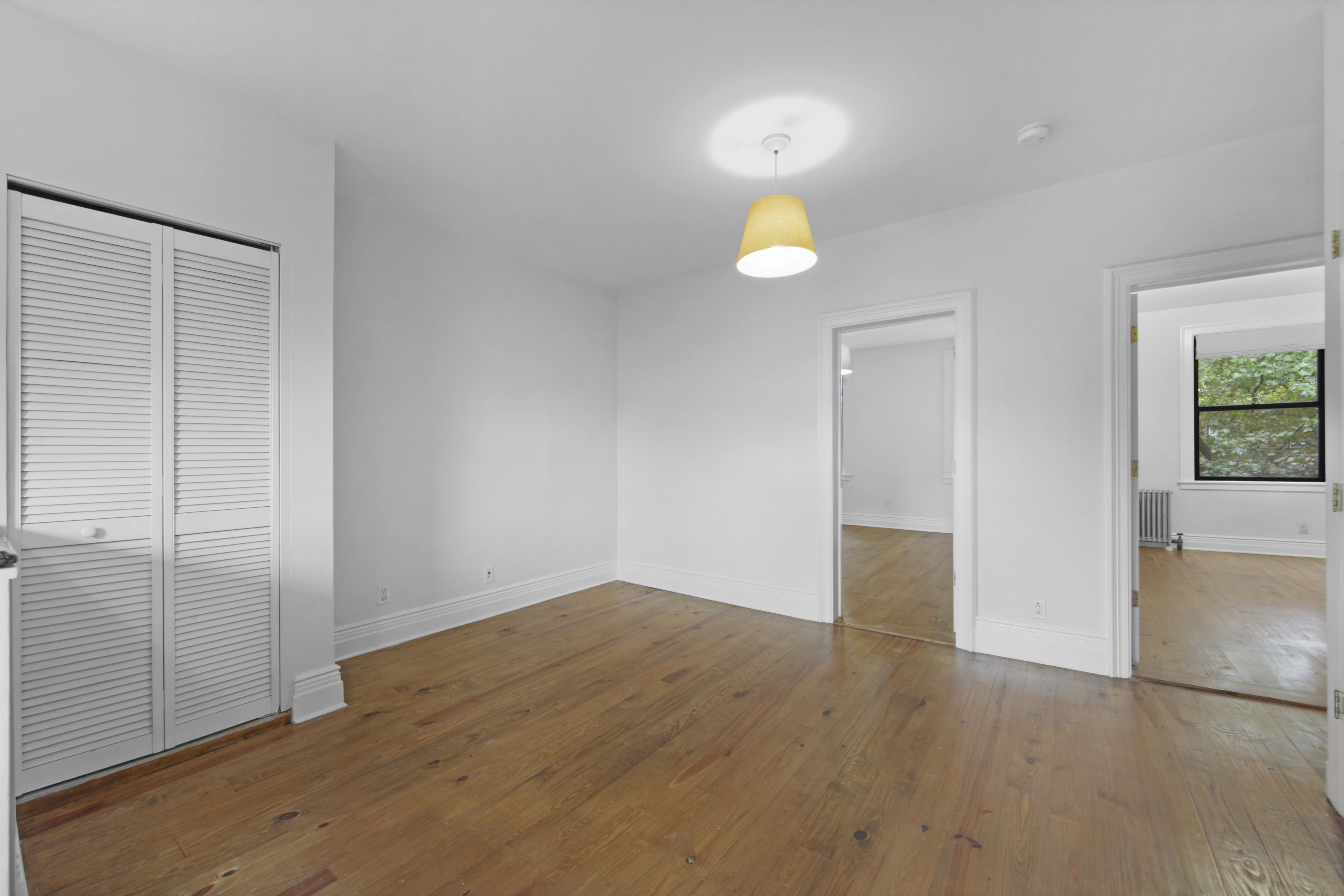 43 Douglass Street, Unit 3 Brooklyn, NY 11231 - Photo 9 of 12 an empty room with wooden floor and window