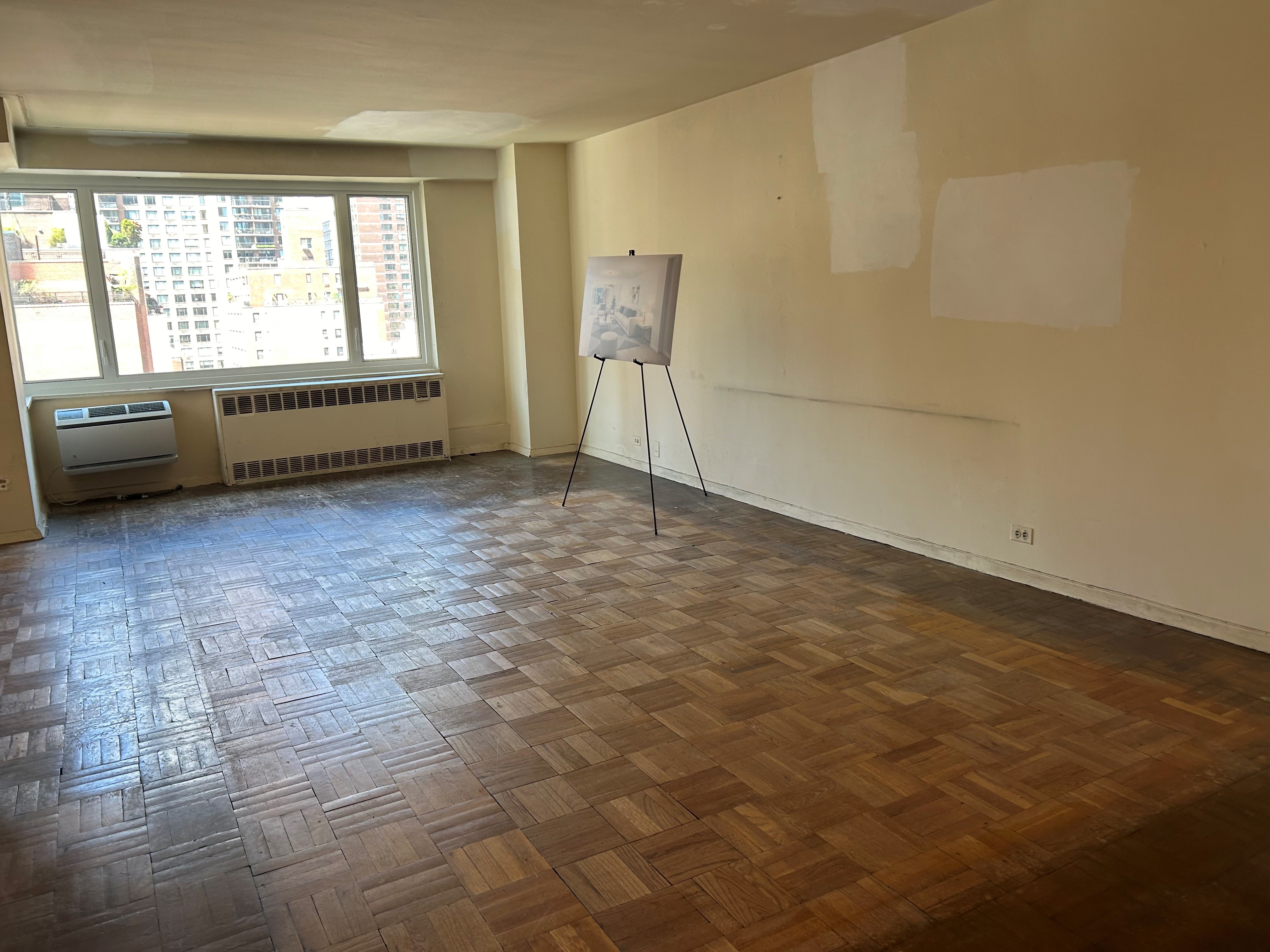 411 East 53rd Street, Unit 11K Manhattan, NY 10022 - Photo 2 of 19 a view of an empty room and window