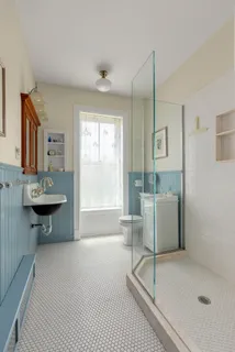 a view of a kitchen with a sink and cabinet area