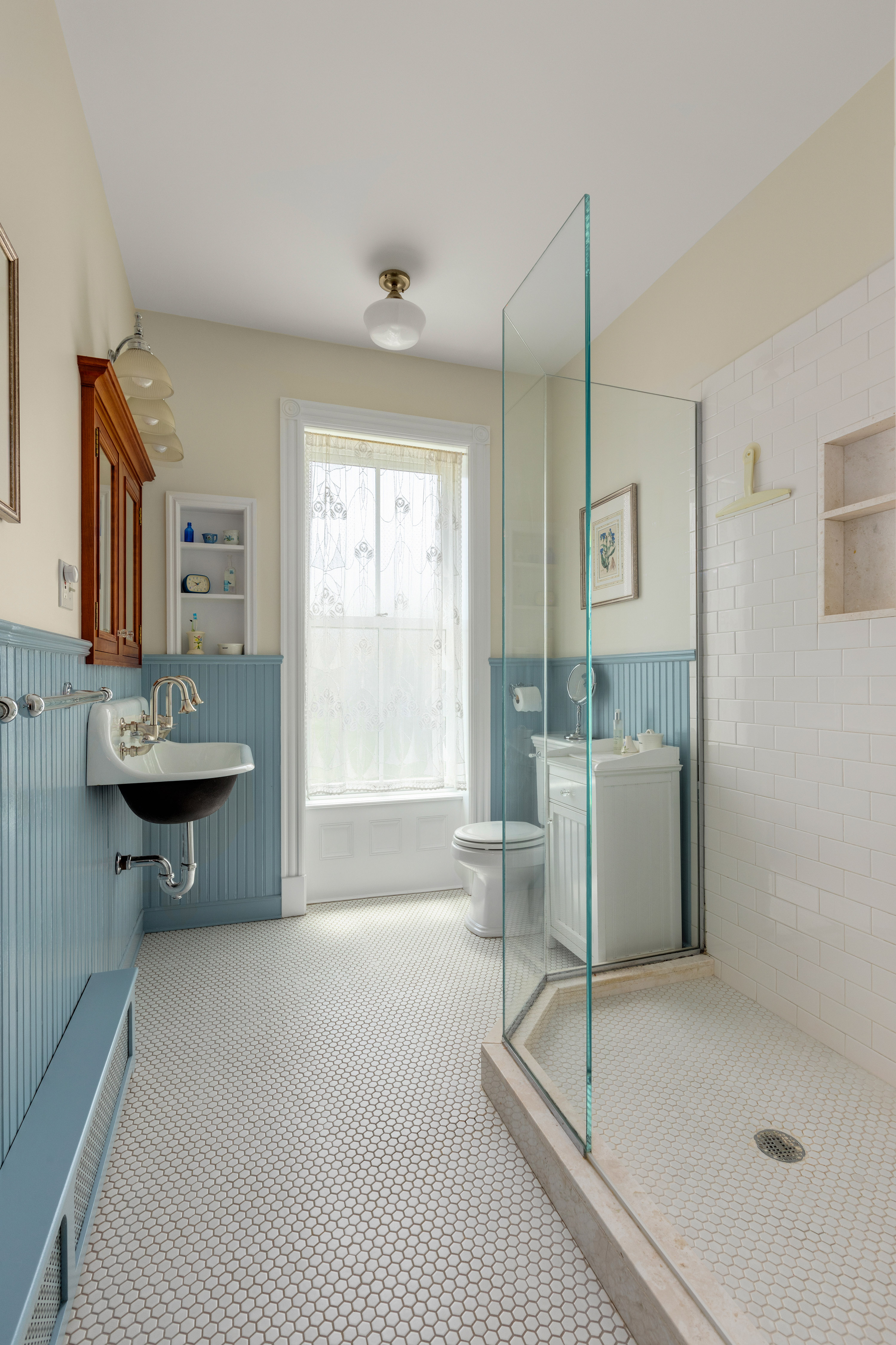470 9th Street Brooklyn, NY 11215 - Photo 17 of 25 a spacious bathroom with a tub shower and window