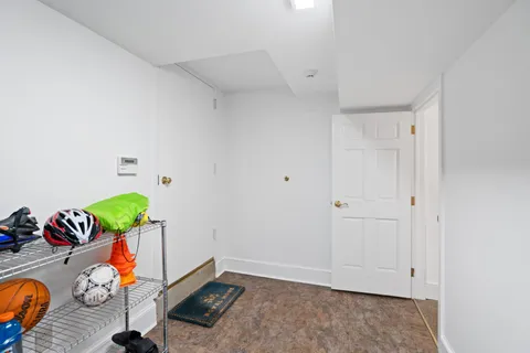 a view of an entryway with wooden floor