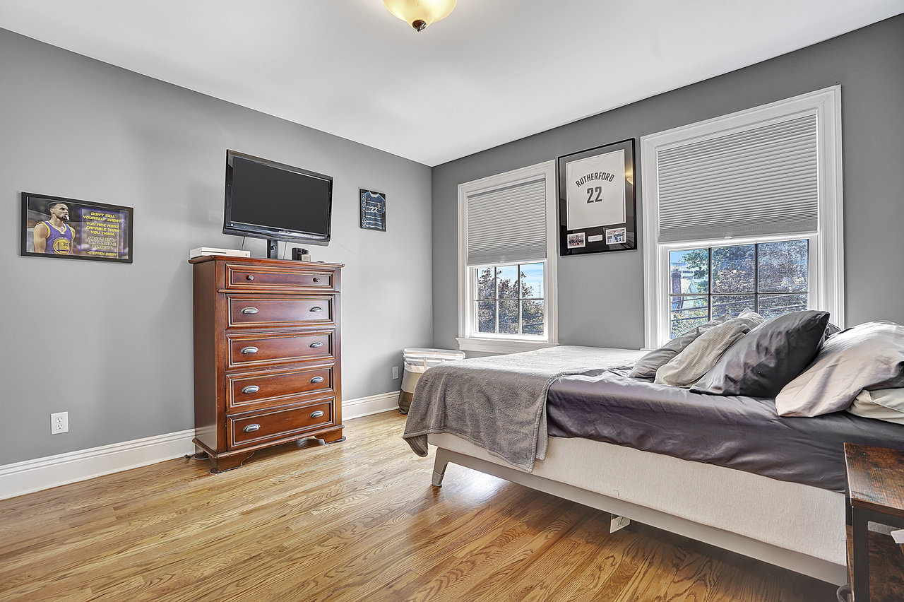 266 Feronia Way Rutherford, NJ 07070 - Photo 25 of 41 a living room with furniture and a flat screen tv