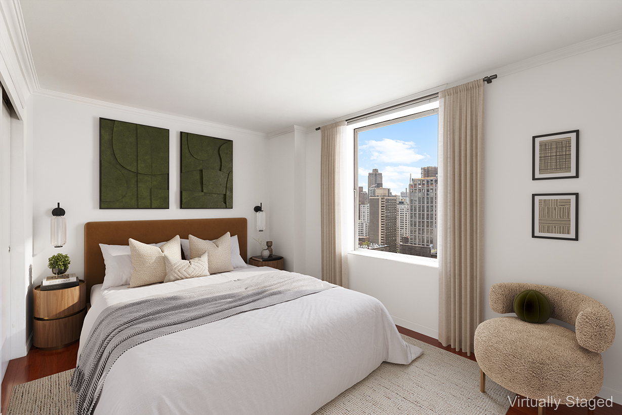 1619 3rd Avenue, Unit 21H Manhattan, NY 10128 - Photo 7 of 16 a bedroom with a bed and window