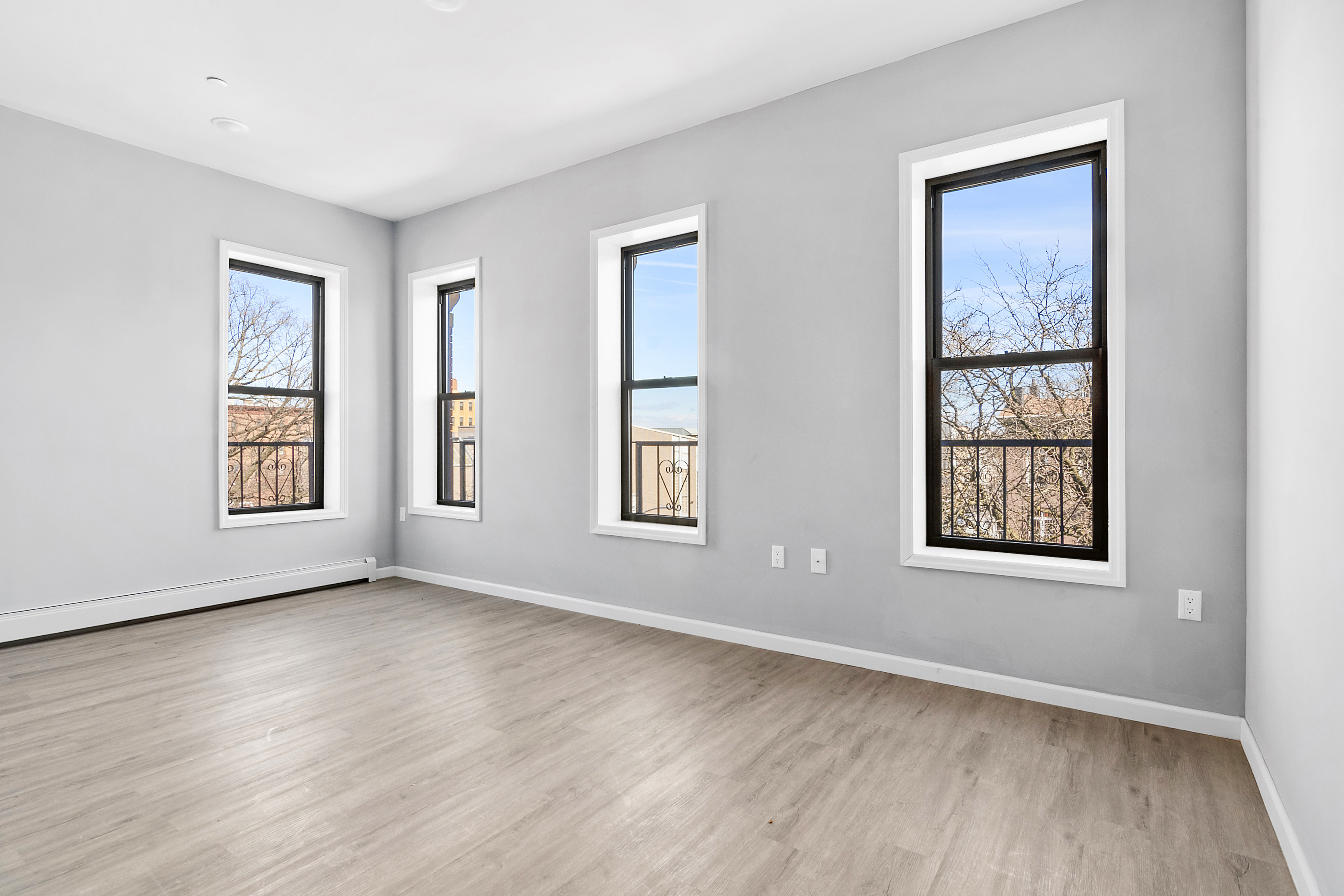 48 Cornelia Street, Unit 3C Brooklyn, NY 11221 - Photo 1 of 4 a view of an empty room with wooden floor and a window