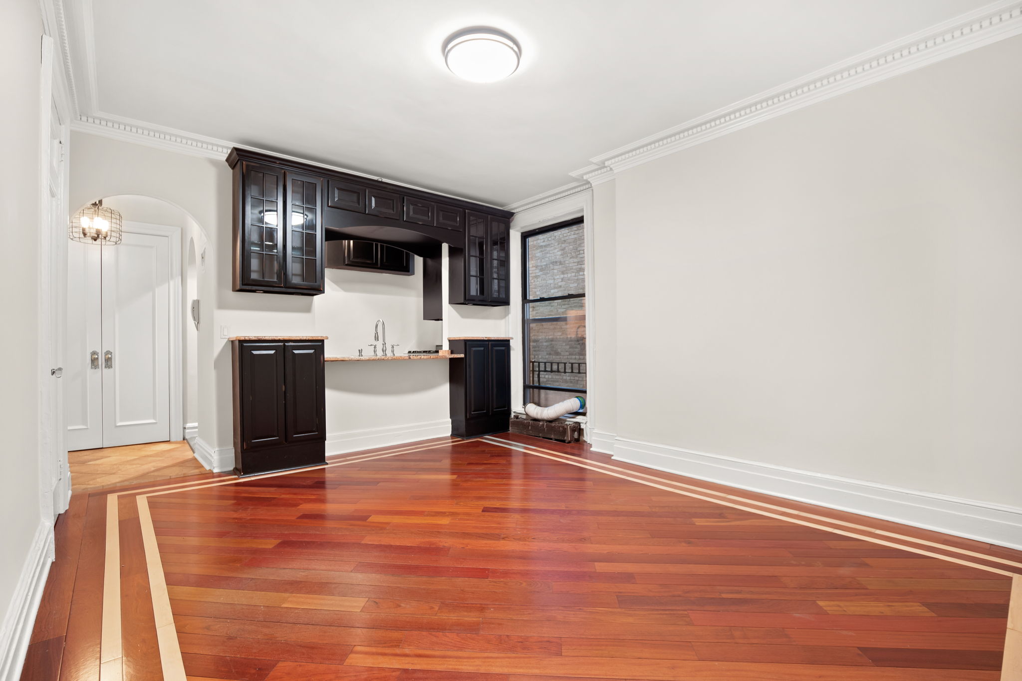 305 West 72nd Street, Unit 7D Manhattan, NY 10023 - Photo 9 of 12 a view of a livingroom with wooden floor