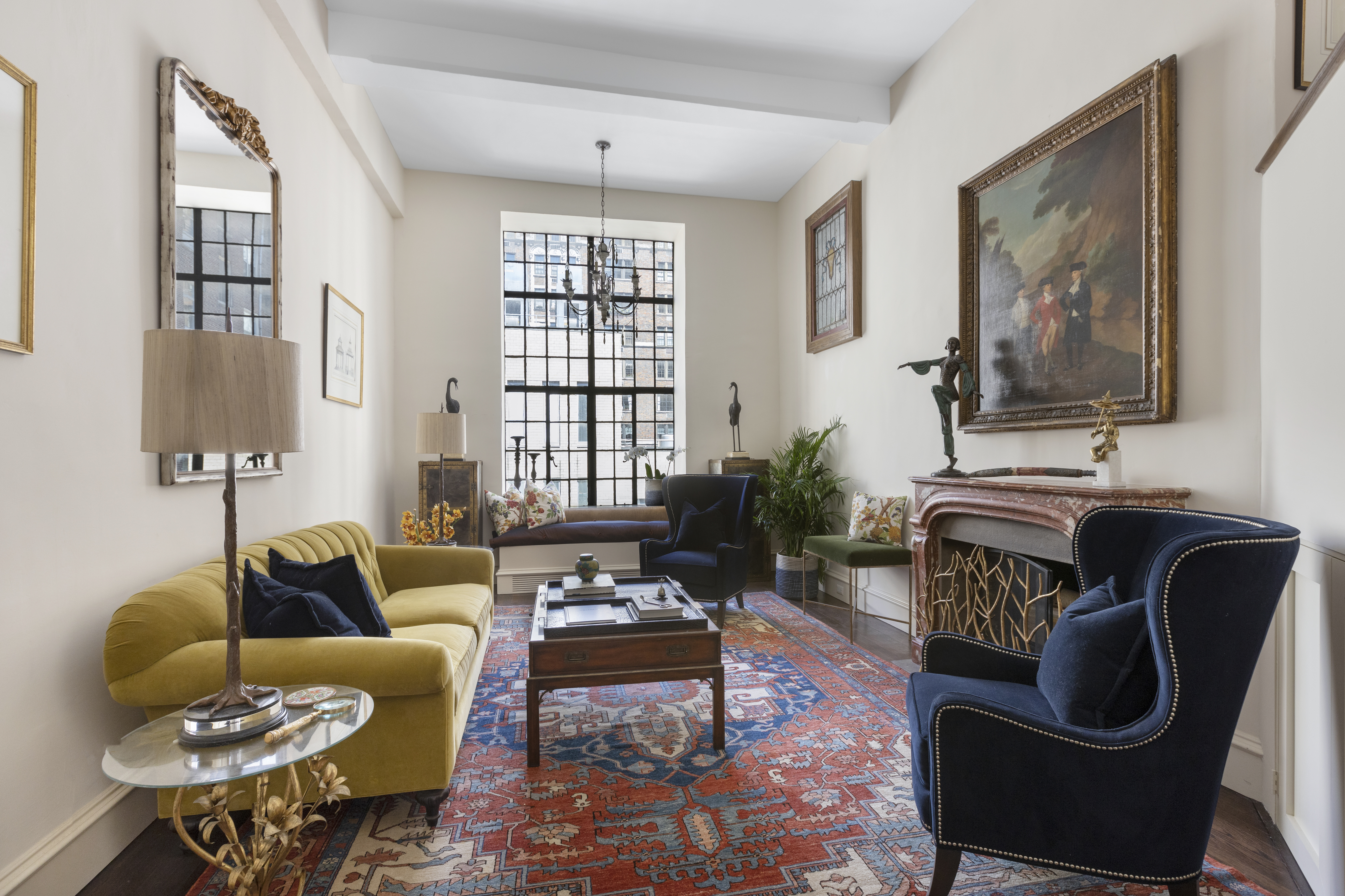 71 East 77th Street, Unit 9C Manhattan, NY 10075 - Photo 1 of 14 a living room with furniture or couch and a potted plant