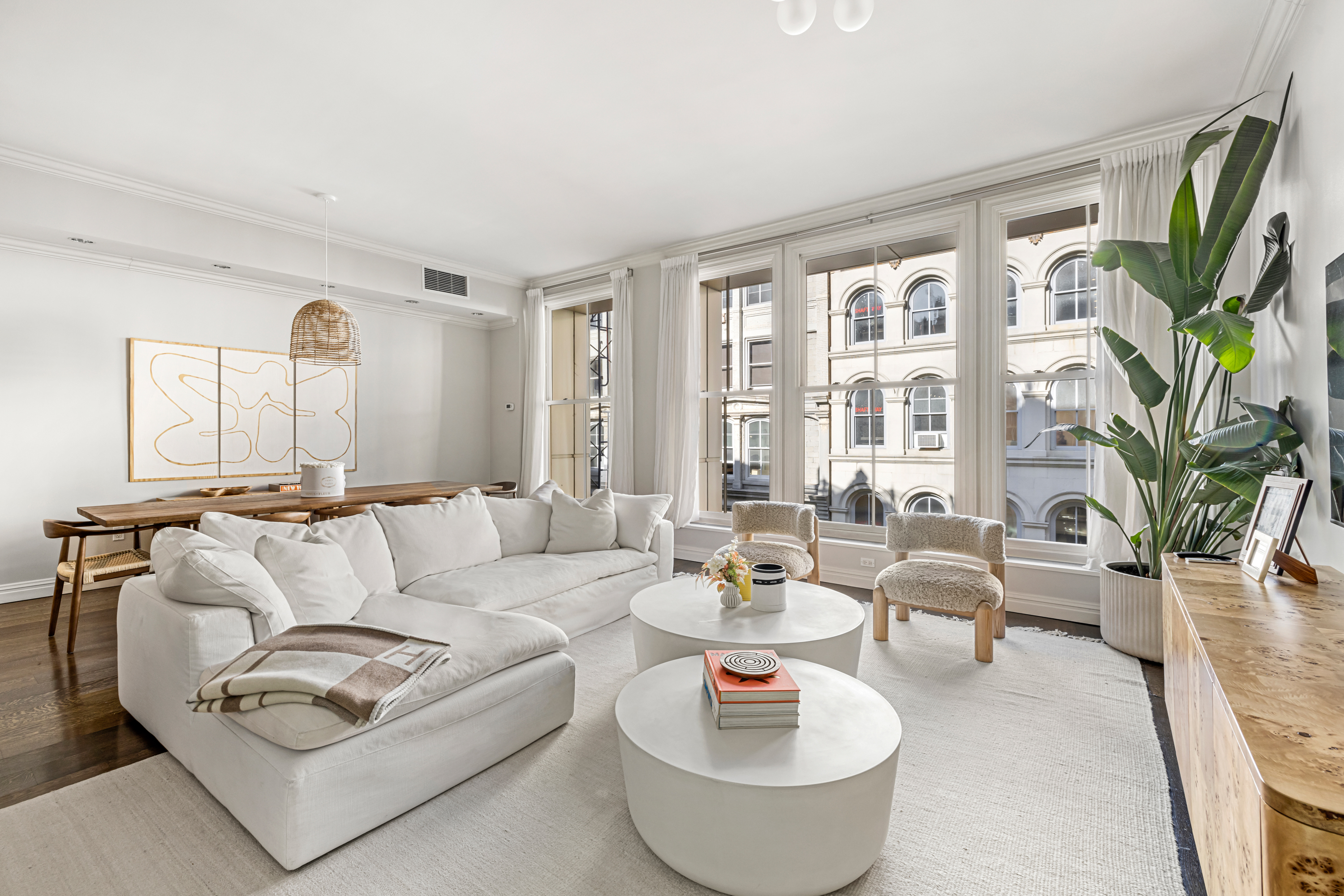 51 Walker Street, Unit 6B Manhattan, NY 10013 - Photo 2 of 10 a living room with furniture and a large window