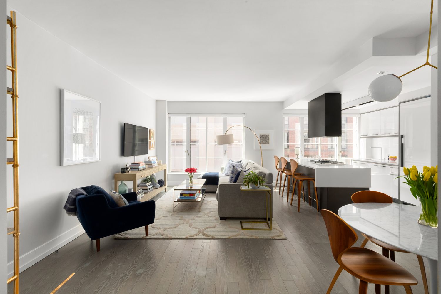 70 Charlton Street, Unit 19D Manhattan, NY 10014 - Photo 2 of 14 a living room with furniture and a large window