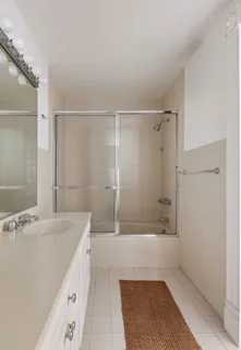 a bathroom with a sink and a shower