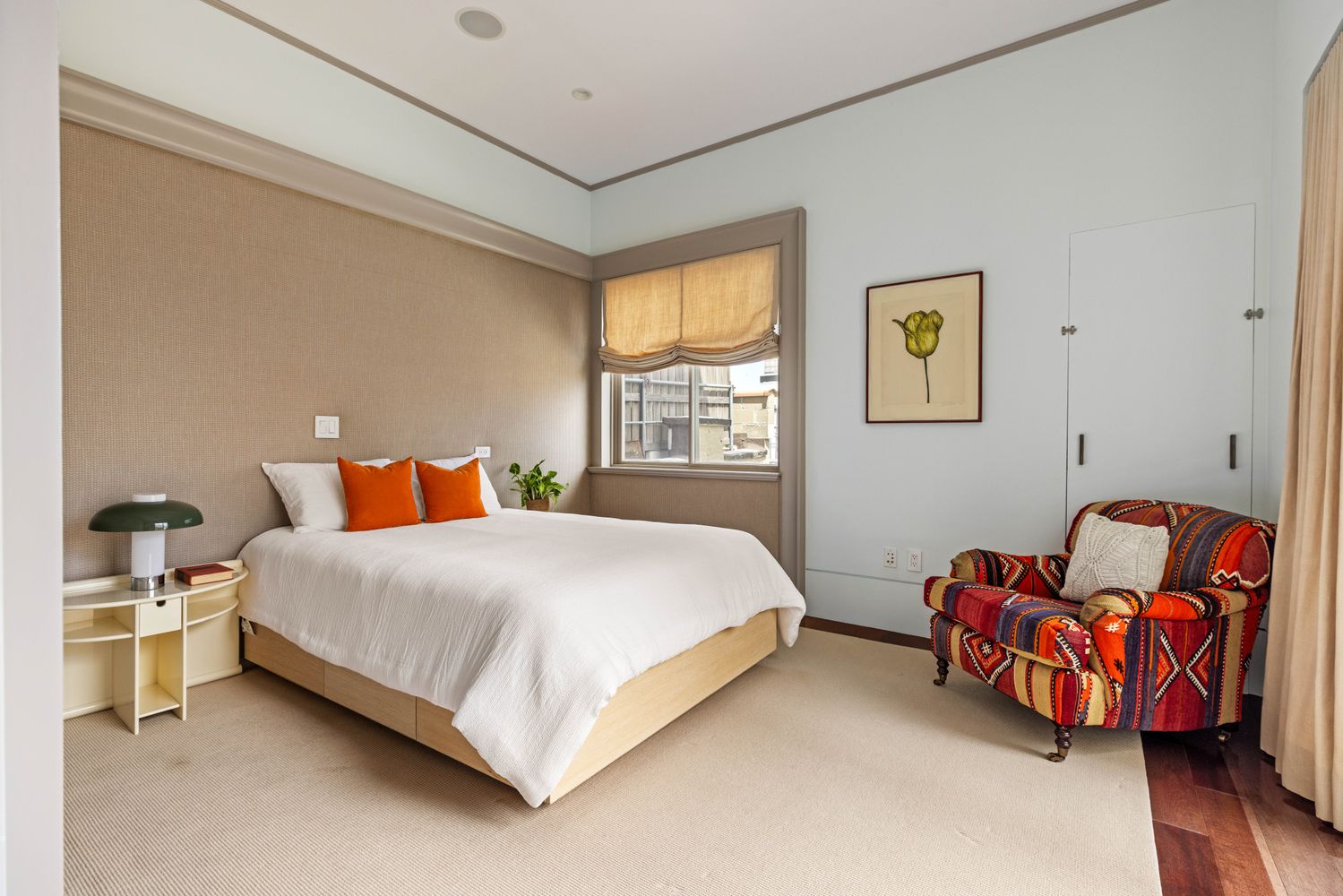 a bedroom with a bed and a couch