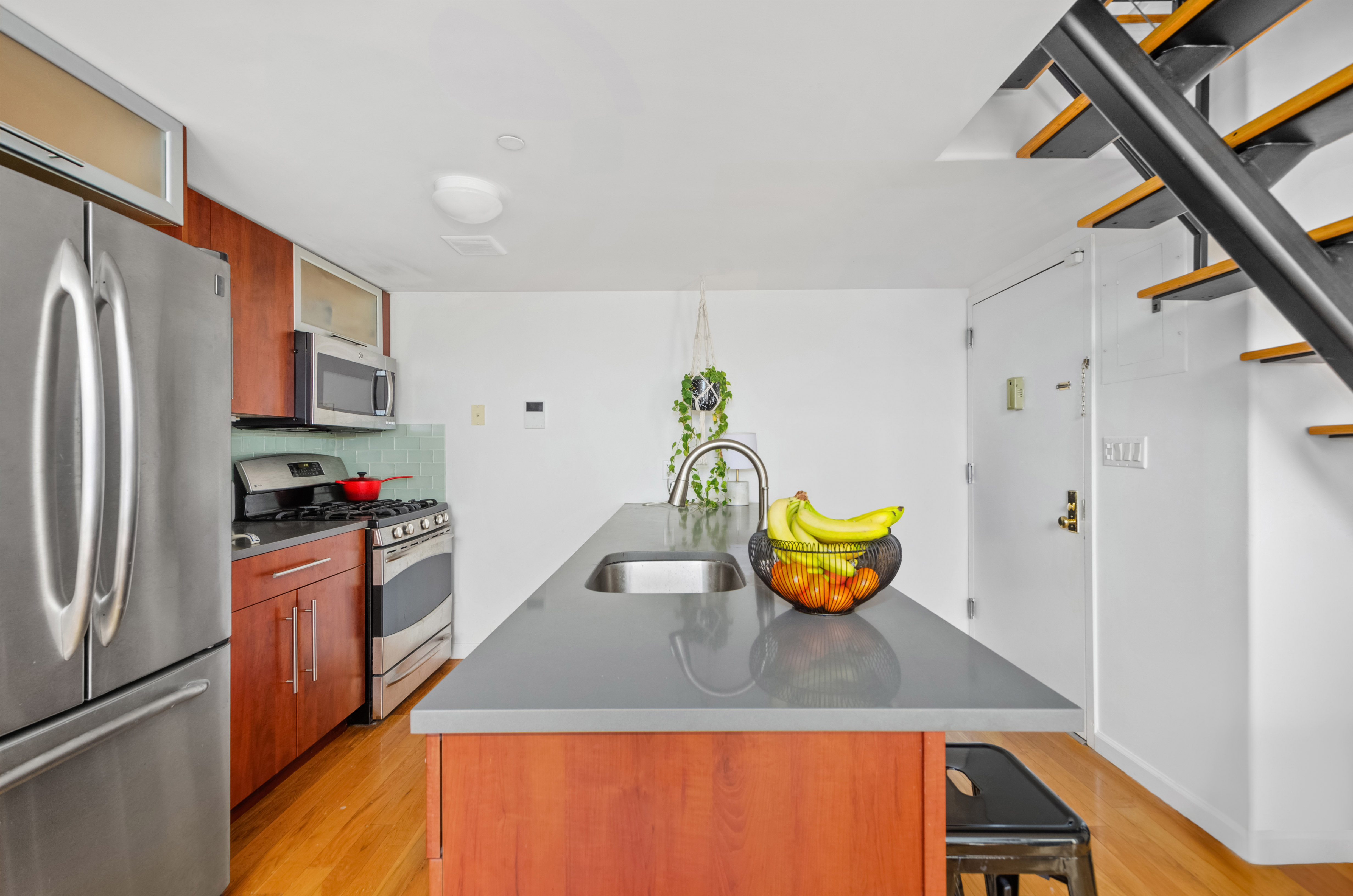 84 Eagle Street, Unit 2D Brooklyn, NY 11222 - Photo 4 of 10 a kitchen with stainless steel appliances granite countertop a refrigerator and a stove