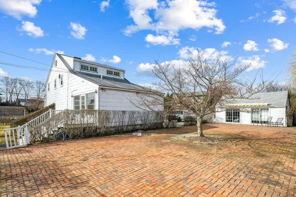 a view of a house with a snow in a yard