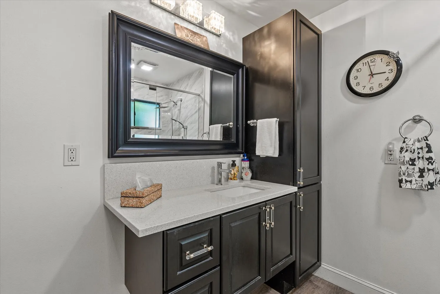 a bathroom with a granite countertop sink a toilet and a mirror