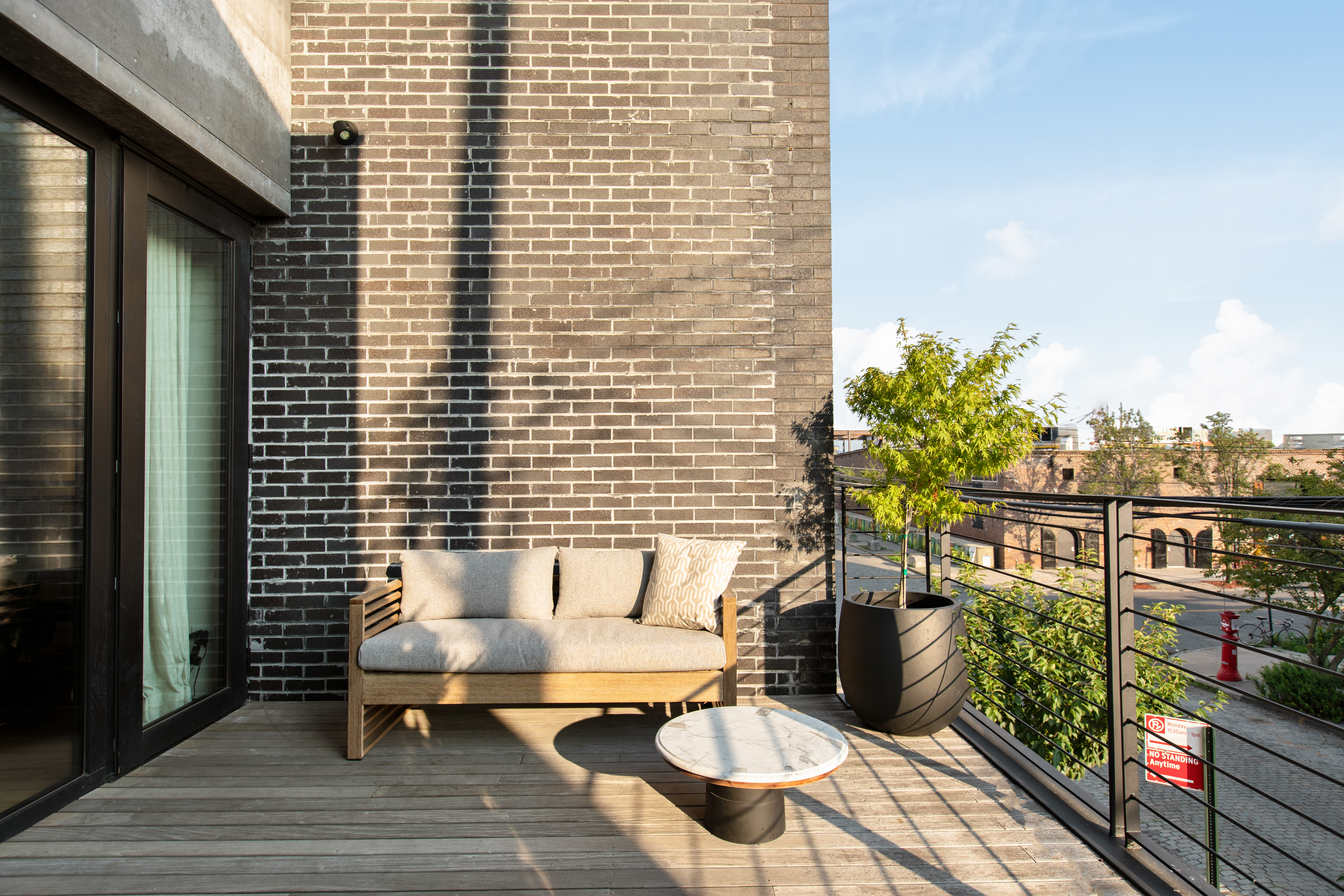 440 Van Brunt Street Brooklyn, NY 11231 - Photo 17 of 33 a view of a balcony with chairs and a potted plant