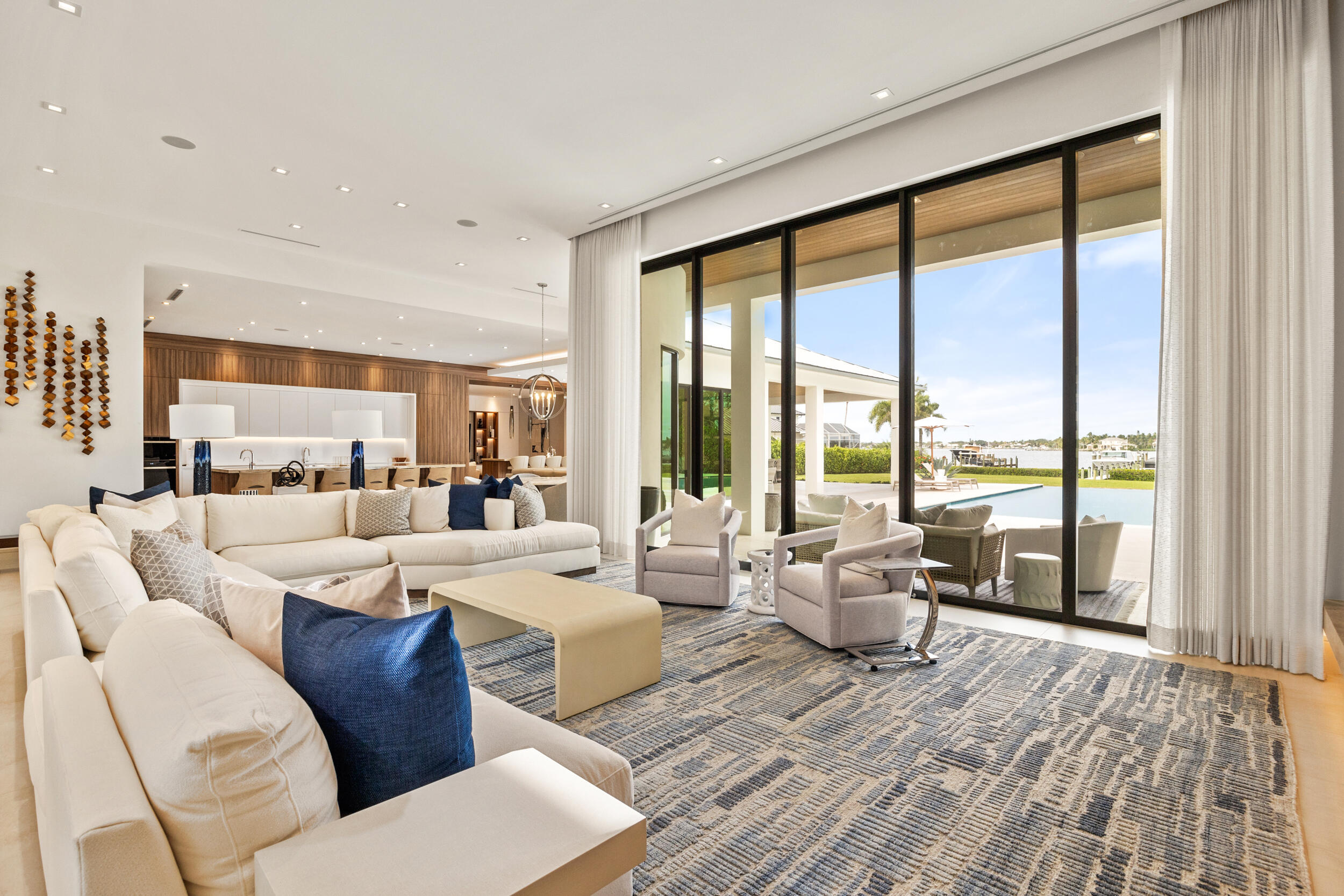 5695 Pennock Point Road Jupiter, FL 33458 - Photo 25 of 77 a living room with furniture large windows and wooden floor