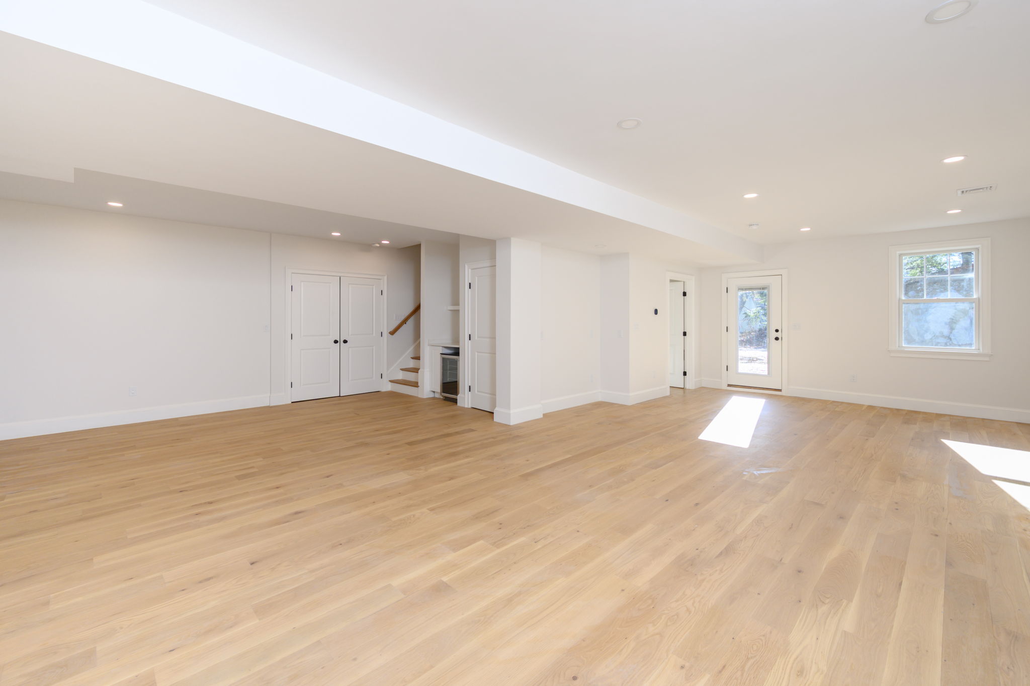 249 Central Avenue Milton, MA 02186 - Photo 44 of 61 a view of empty room with wooden floor and window