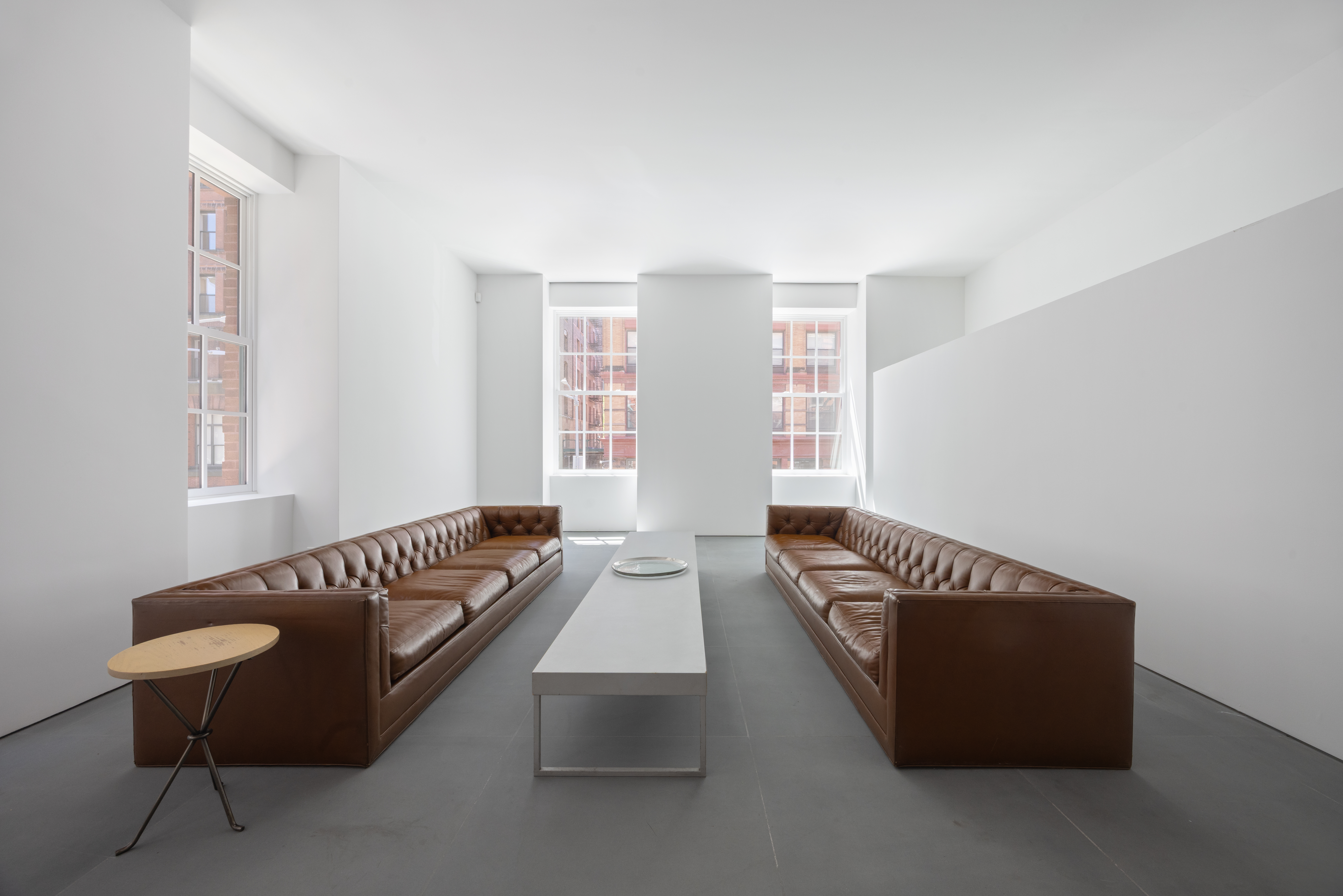9 Jay Street Manhattan, NY 10013 - Photo 9 of 32 a living room with furniture and a window
