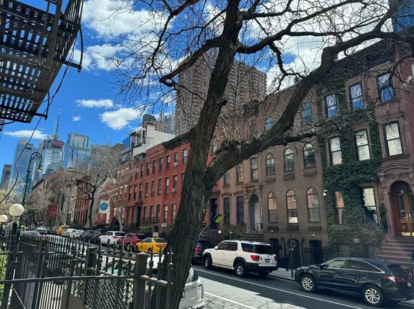 a view of a street with cars