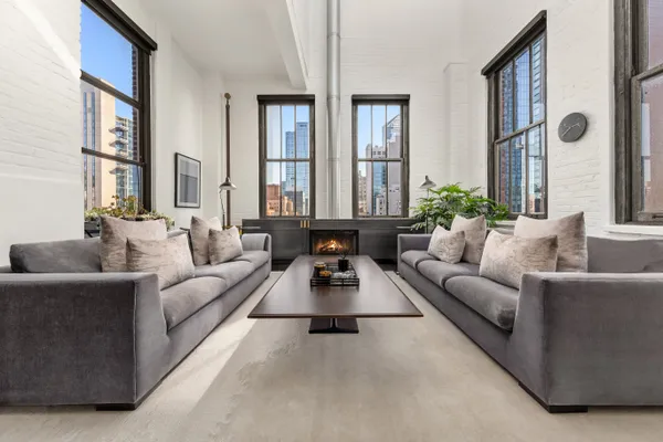 a living room with furniture and windows