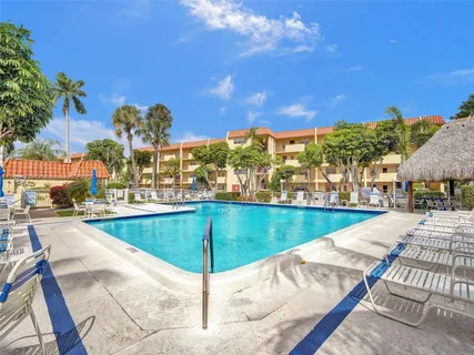 a view of a swimming pool with a lounge chairs