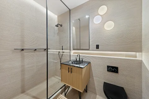a bathroom with a sink a vanity and a mirror