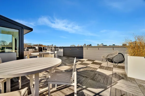 a view of a terrace with furniture and stove