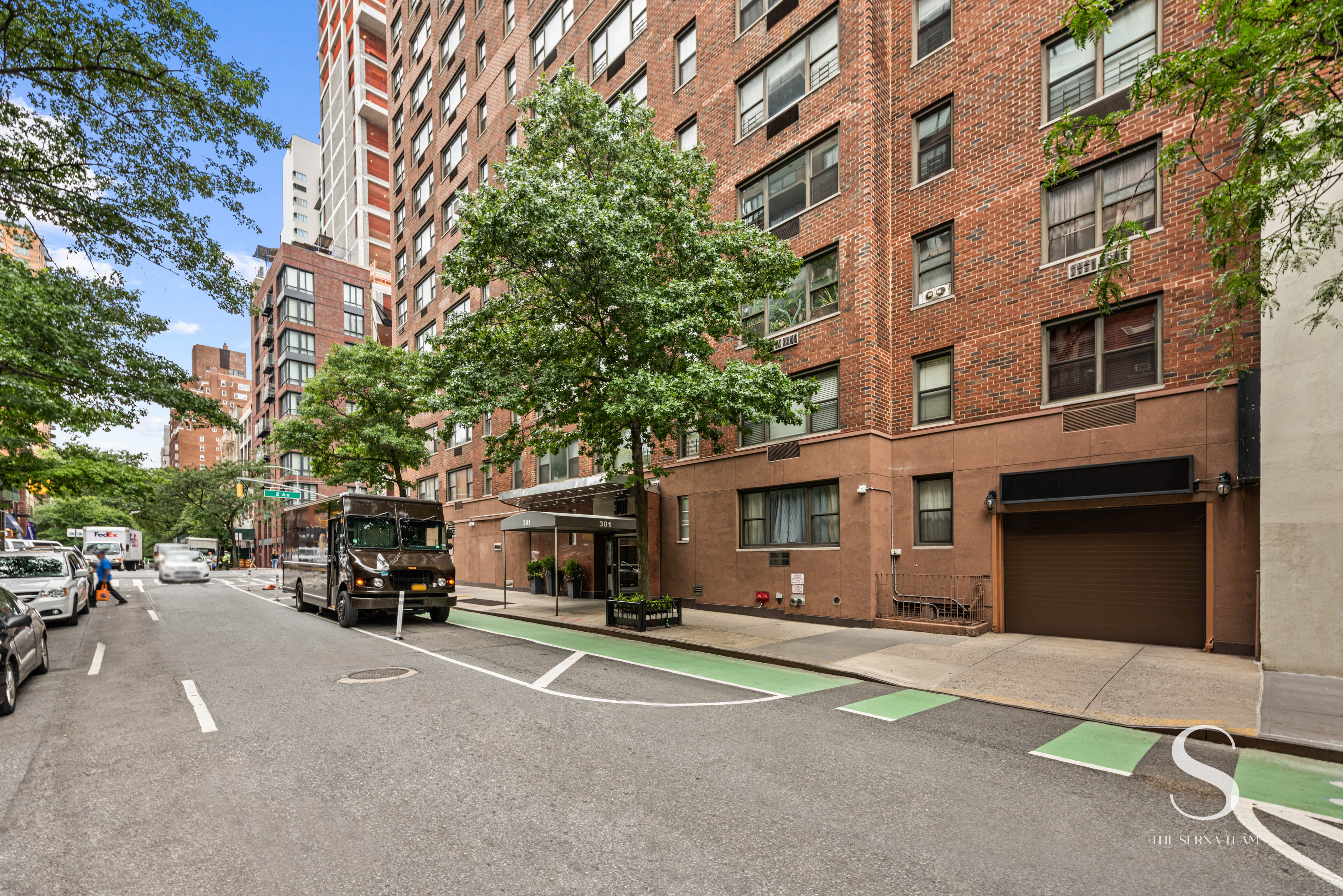301 East 62nd Street, Unit 5E Manhattan, NY 10065 - Photo 7 of 15 a car parked in front of a building