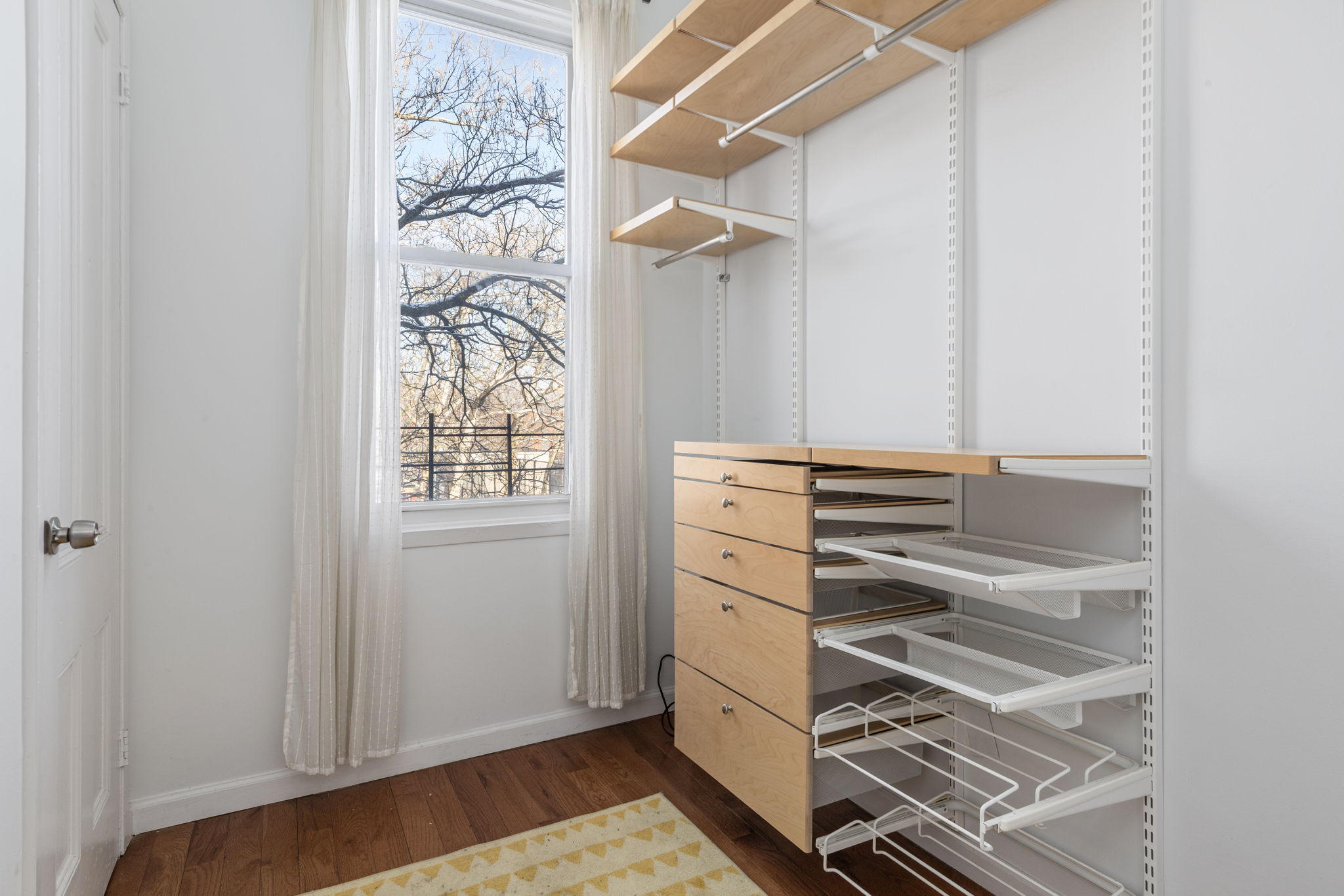 1218 Saint Marks Avenue Brooklyn, NY 11213 - Photo 14 of 42 a view of walk in closet with clothes and shoes