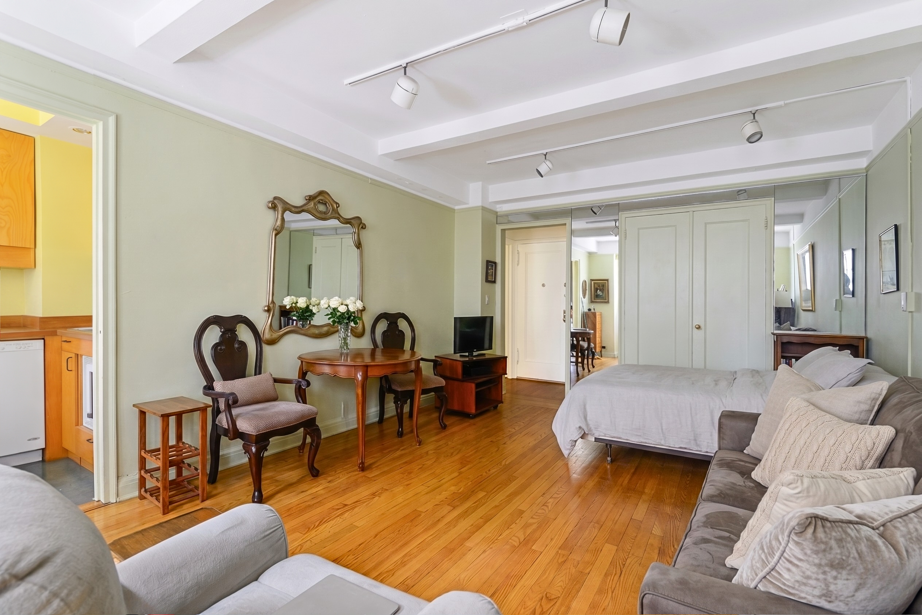 201 West 16th Street, Unit 3C Manhattan, NY 10011 - Photo 2 of 11 a living room with furniture and wooden floor
