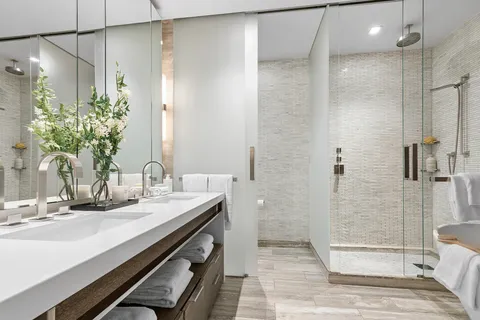 a bathroom with a shower and a sink