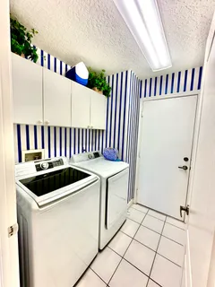 a kitchen with a sink and a refrigerator