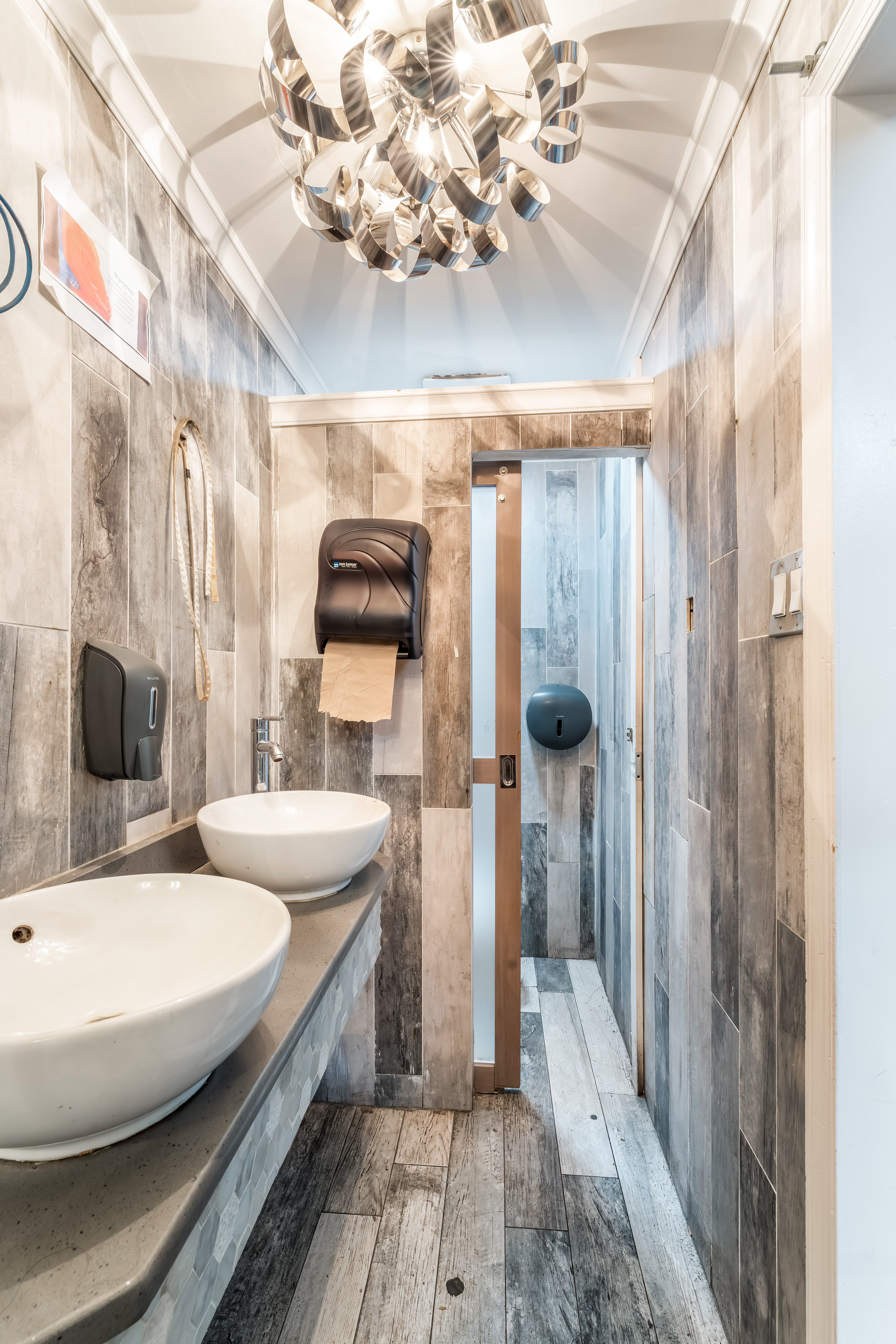 646 Newark Avenue, Unit COMMERCIAL Jersey City, NJ 07306 - Photo 15 of 35 a bathroom with a double vanity sink mirror and shower