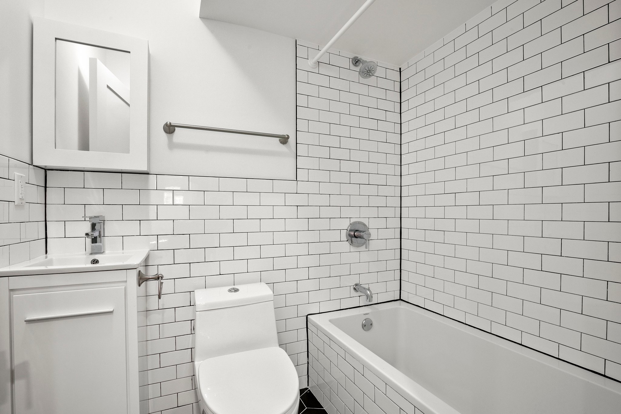 1130 Decatur Street Brooklyn, NY 11207 - Photo 21 of 24 a bathroom with a sink toilet and shower