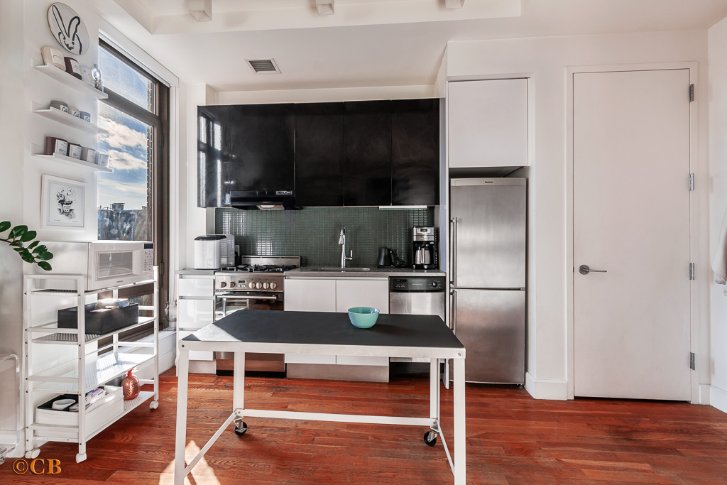 315 Gates Avenue, Unit 3H Brooklyn, NY 11216 - Photo 3 of 12 a living room with a table and chairs