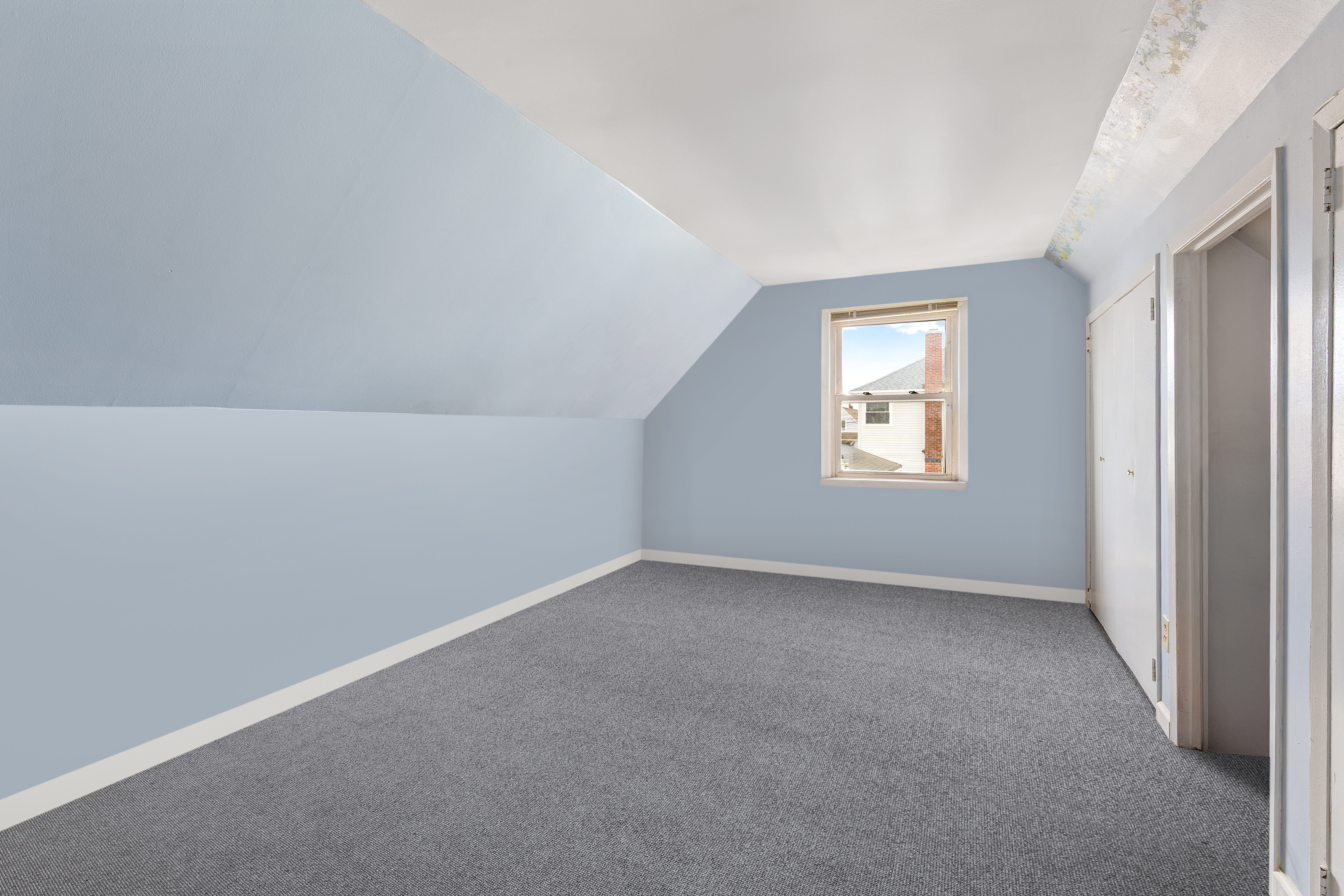 241-12 148th Avenue Queens, NY 11422 - Photo 11 of 15 an empty room with windows