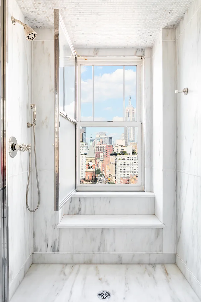 a bathroom with a bathtub and a shower