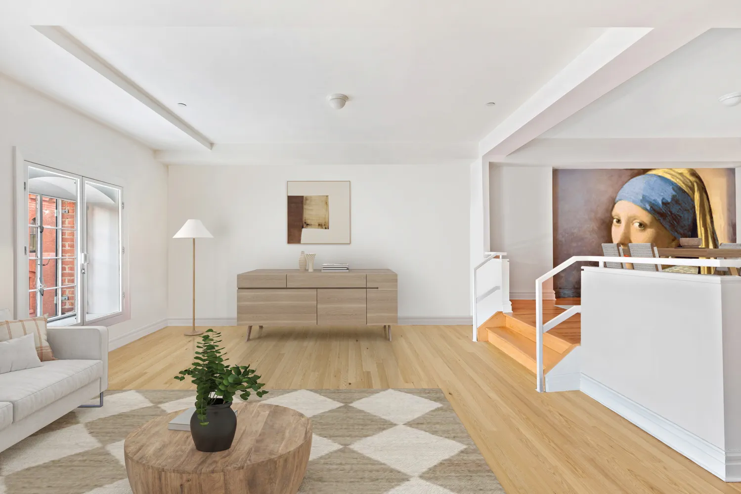 a living room with furniture and a potted plant