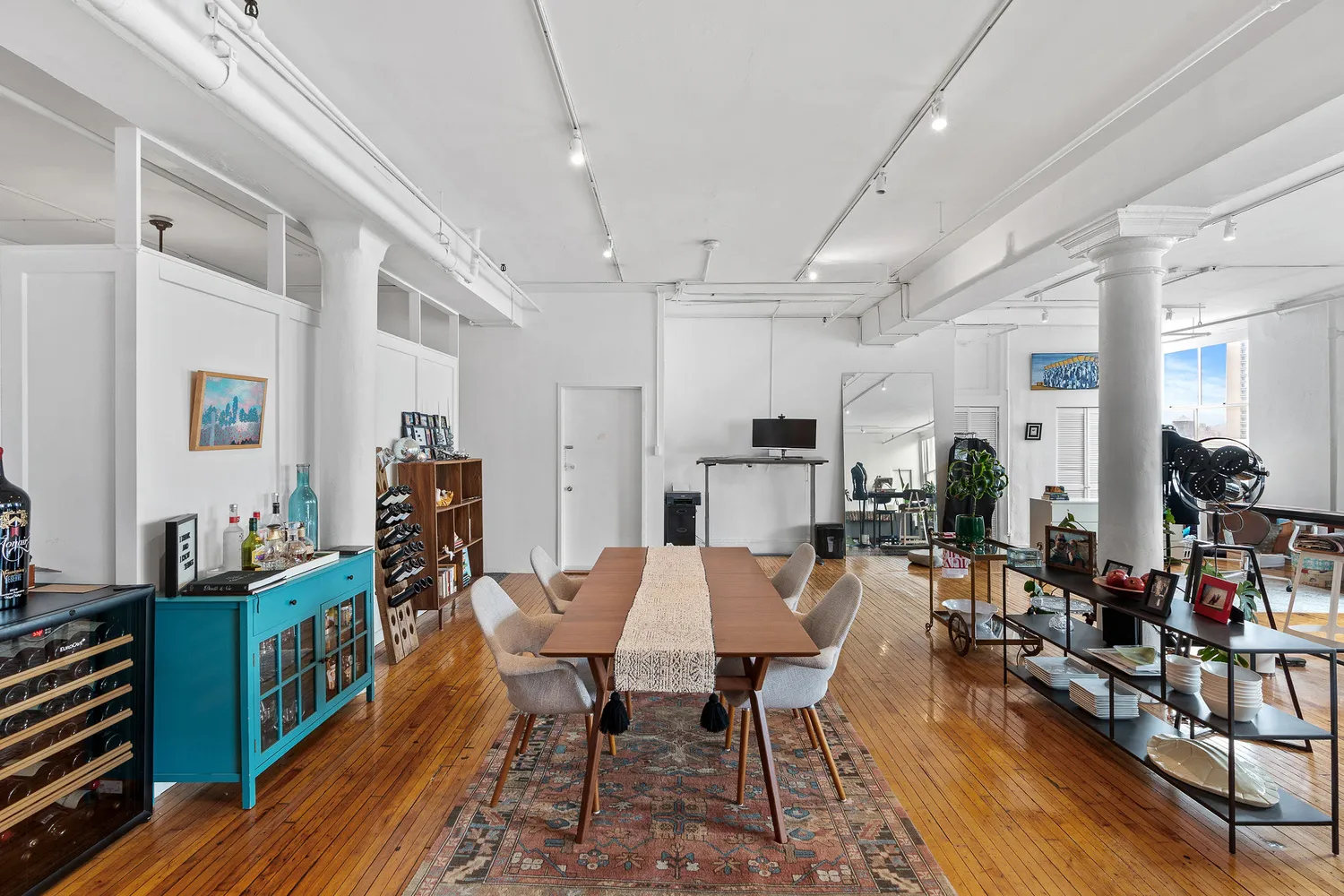 a view of a dining room with furniture window and wooden floor