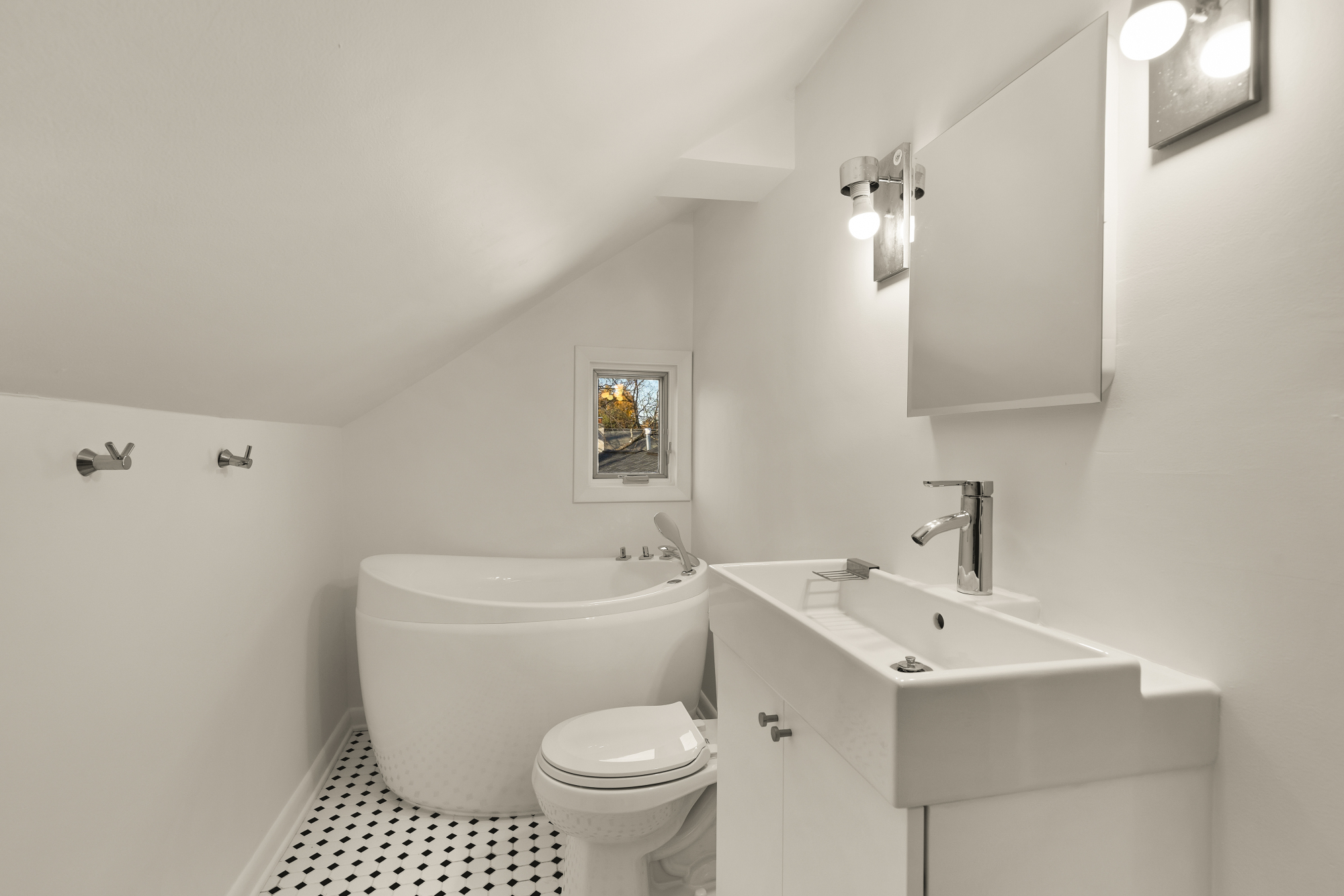 6815 Delaware Street Chevy Chase, MD 20815 - Photo 22 of 34 a bathroom with a sink a toilet and shower