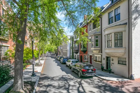 a car parked in front of brick building