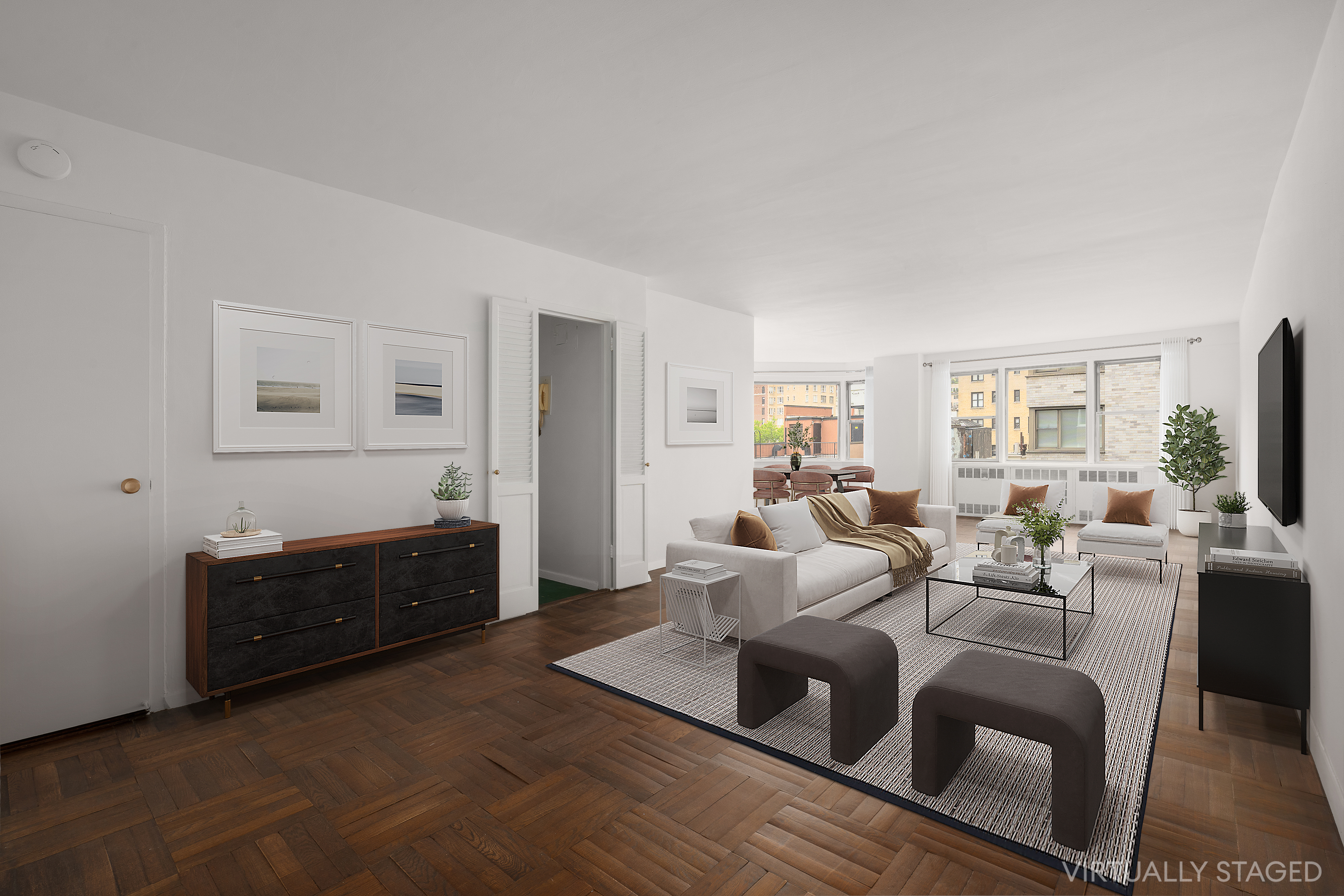 a living room with furniture a flat screen tv and a window