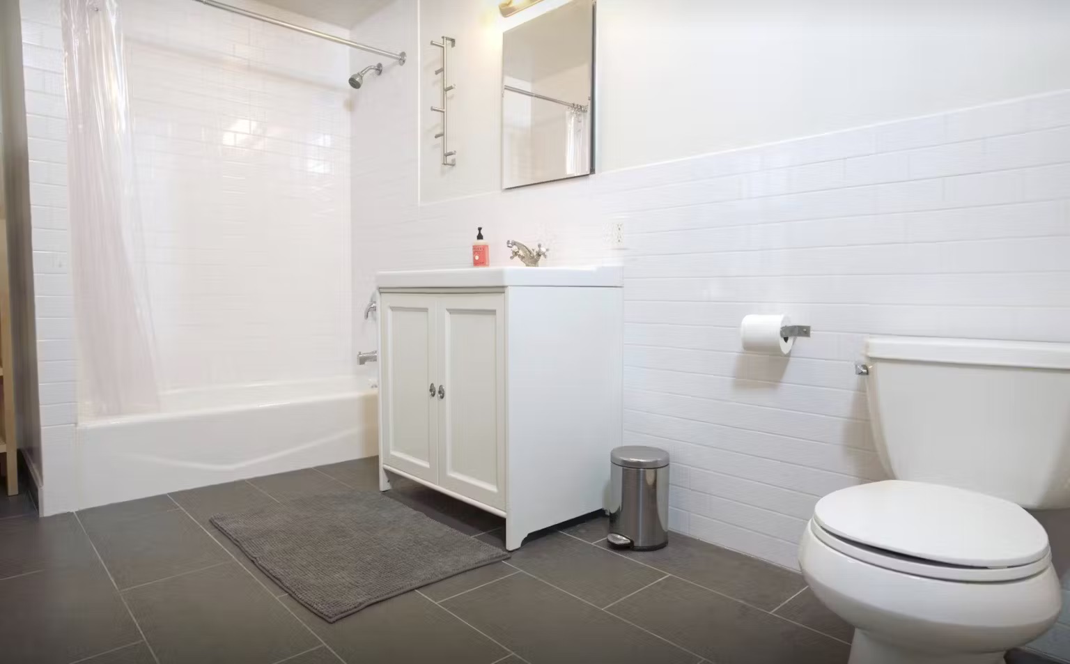 899 Lincoln Place, Unit 1 Brooklyn, NY 11213 - Photo 7 of 9 a bathroom with a toilet and a shower